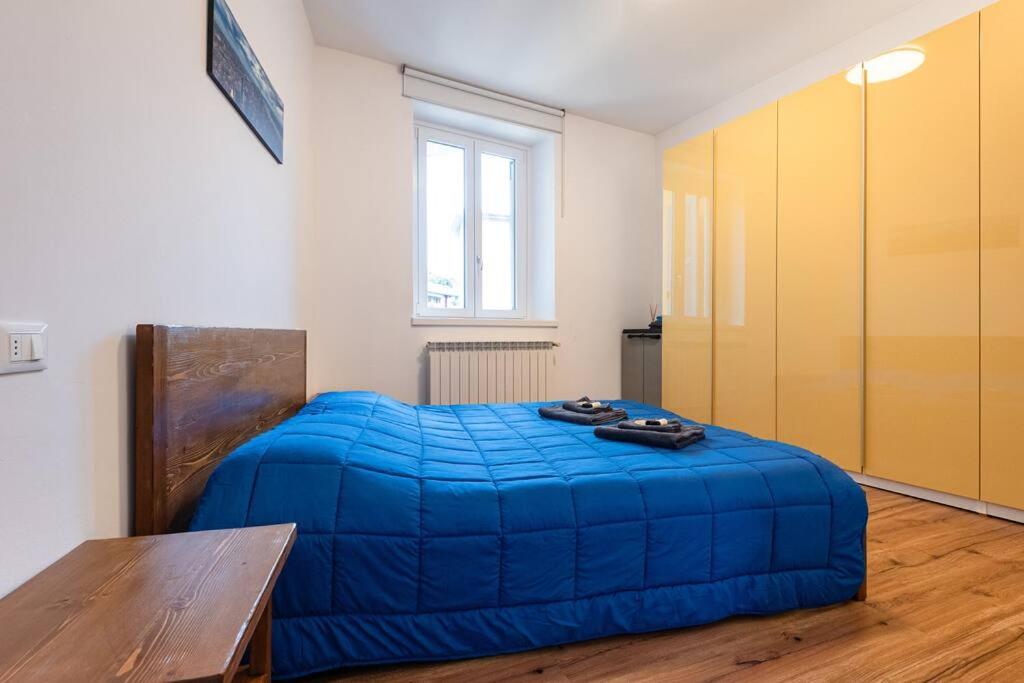 Postel nebo postele na pokoji v ubytování [Gewiss Stadium] Luxury Apartment With Terrace