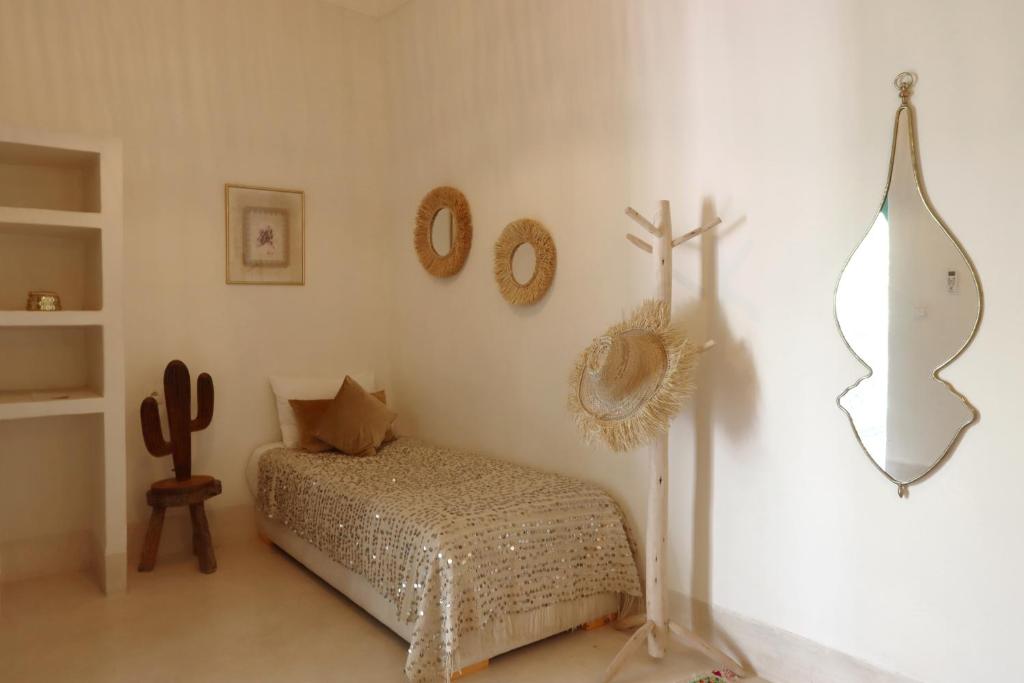 Postelja oz. postelje v sobi nastanitve Riad NaaNaa Bed & Breakfast