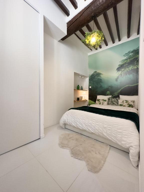 Posteľ alebo postele v izbe v ubytovaní Le Cosy Safranier Vieil Antibes