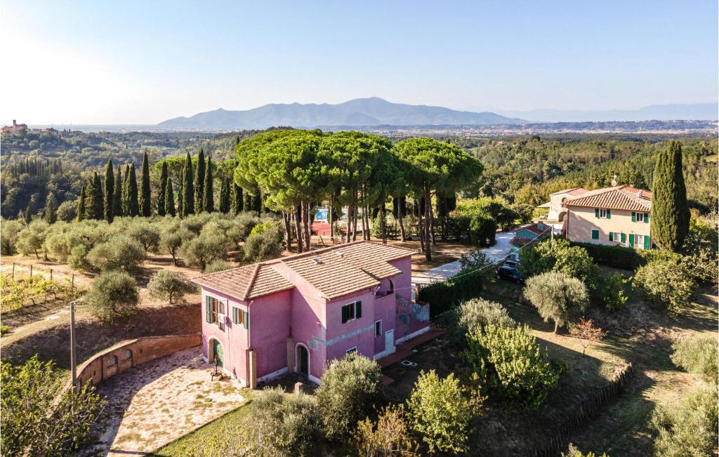 an aerial view of a pink house with trees at Villa Sambuco in San Gervasio