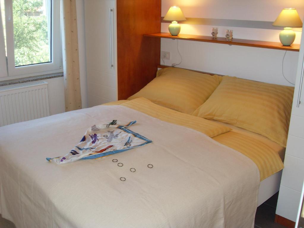 Postel nebo postele na pokoji v ubytování Apartments Ilona
