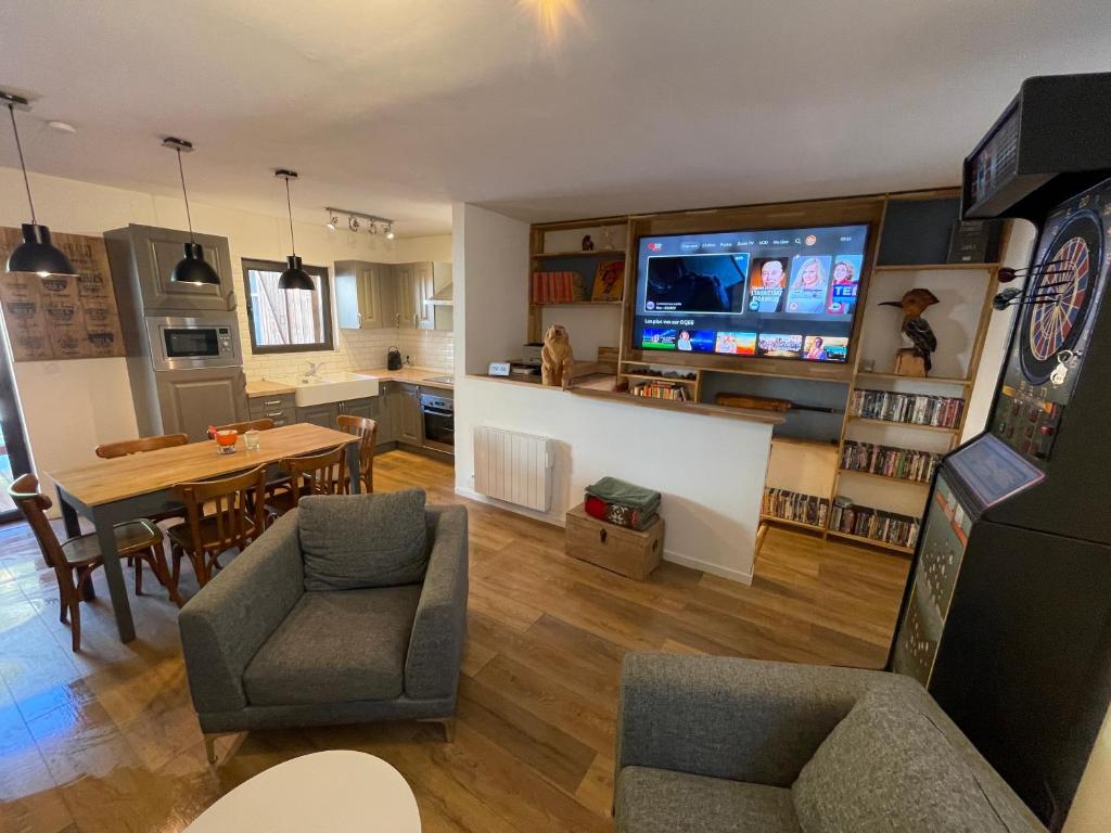 a living room with a kitchen and a dining room at maison colmars in Colmars