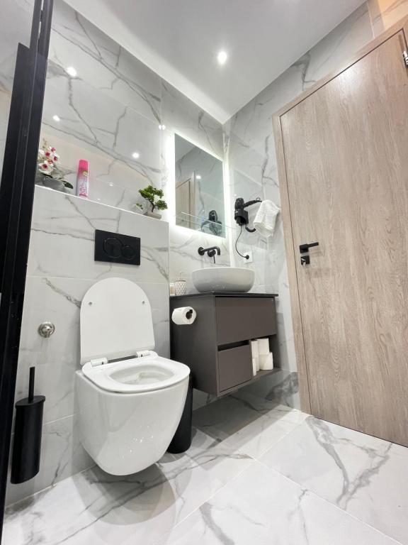 Koupelna v ubytování Apollo 2 bd Jacuzzi Suite