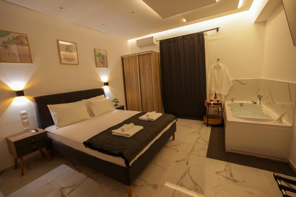 Postel nebo postele na pokoji v ubytování Apollo 2 bd Jacuzzi Suite
