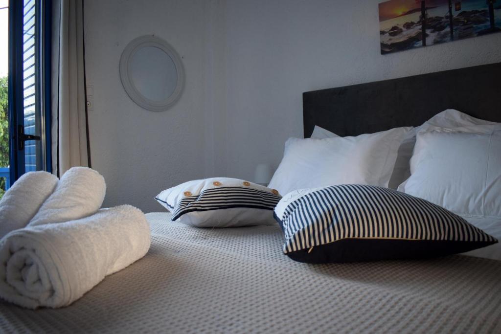 Posteľ alebo postele v izbe v ubytovaní Katovigli Seaview Apartment