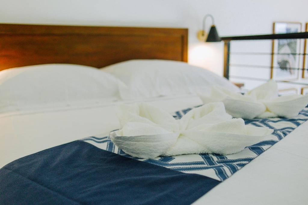 Postel nebo postele na pokoji v ubytování Panglao Lofts
