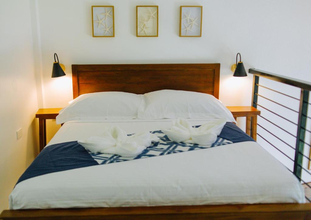 Postel nebo postele na pokoji v ubytování Panglao Lofts