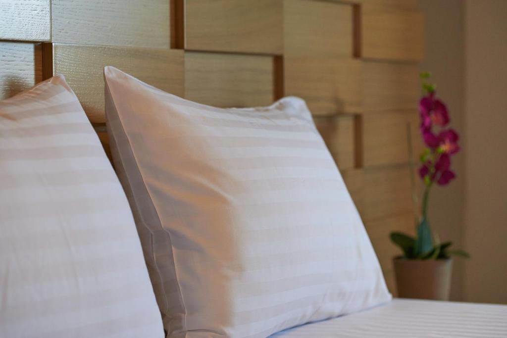 Posteľ alebo postele v izbe v ubytovaní Athos Thea Luxury Rooms