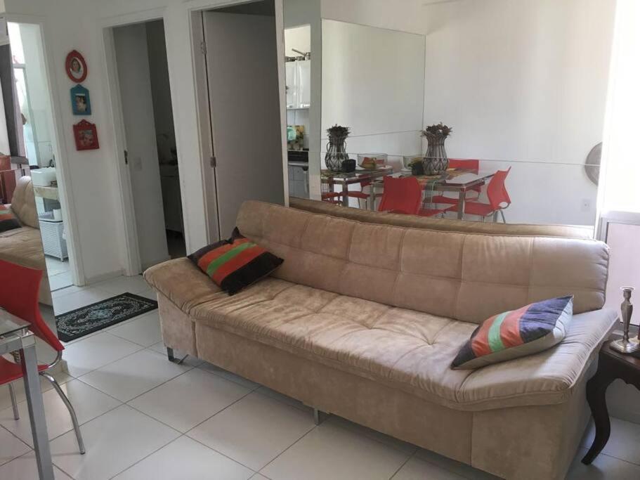 a living room with a couch and a dining room at Petrolina in Petrolina