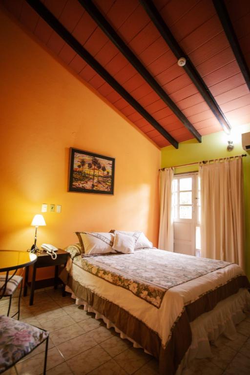 Postel nebo postele na pokoji v ubytování Hotel Santo Domingo