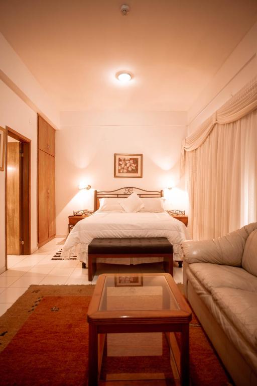 Postel nebo postele na pokoji v ubytování Hotel Santo Domingo