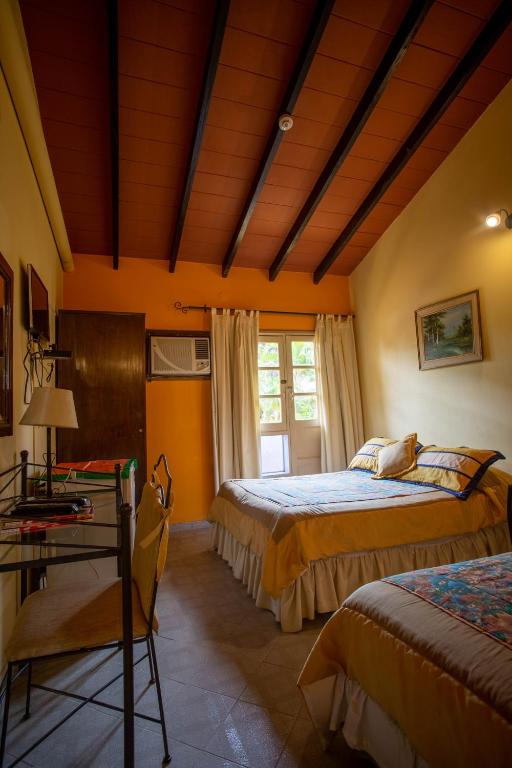 Postel nebo postele na pokoji v ubytování Hotel Santo Domingo