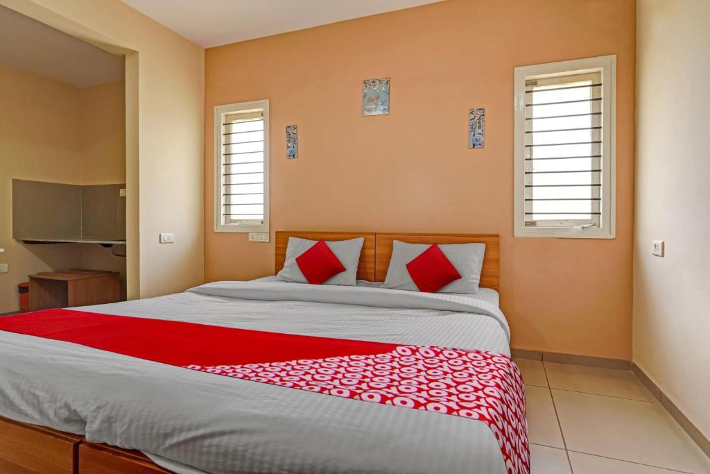 Postel nebo postele na pokoji v ubytování Super Hotel O Indra Suites