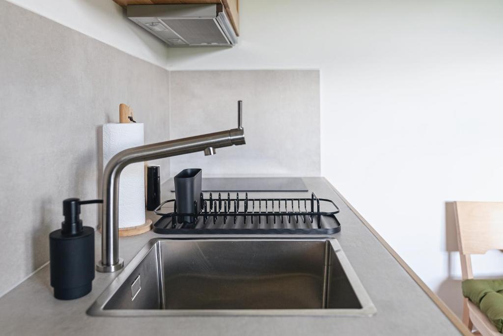Kuchyňa alebo kuchynka v ubytovaní Apartamenty Przystanek Grapa