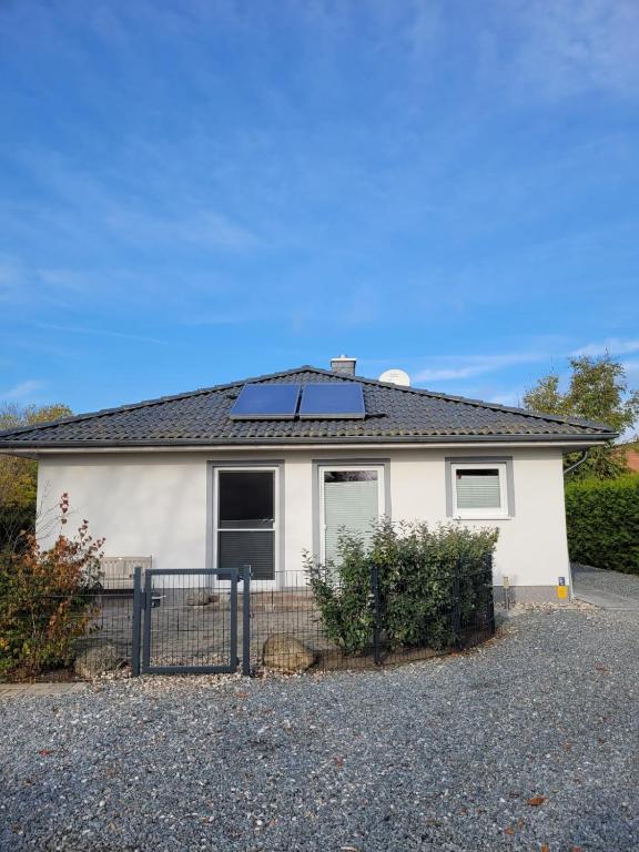 a house with a solar panel on top of it at Ferienhaus Gammendorf in Gammendorf