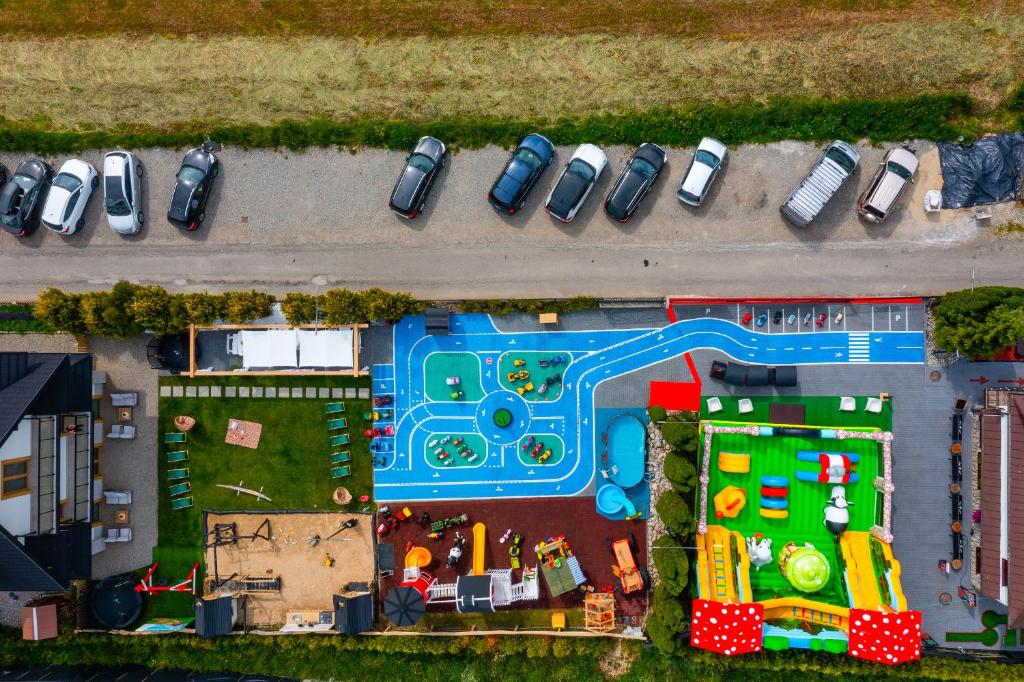 an overhead view of a toy park with cars parked at Ceprówka Family Friendly in Białka Tatrzanska
