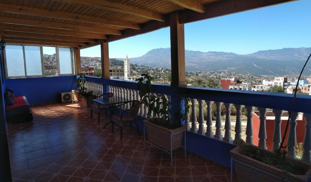 a balcony with a view of a city at Casa Abdou in Chefchaouene