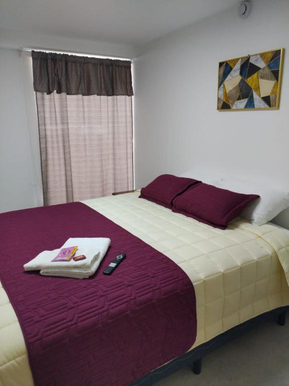 Postel nebo postele na pokoji v ubytování HOSTAL VERONA