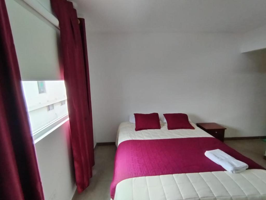 Postel nebo postele na pokoji v ubytování HOSTAL VERONA