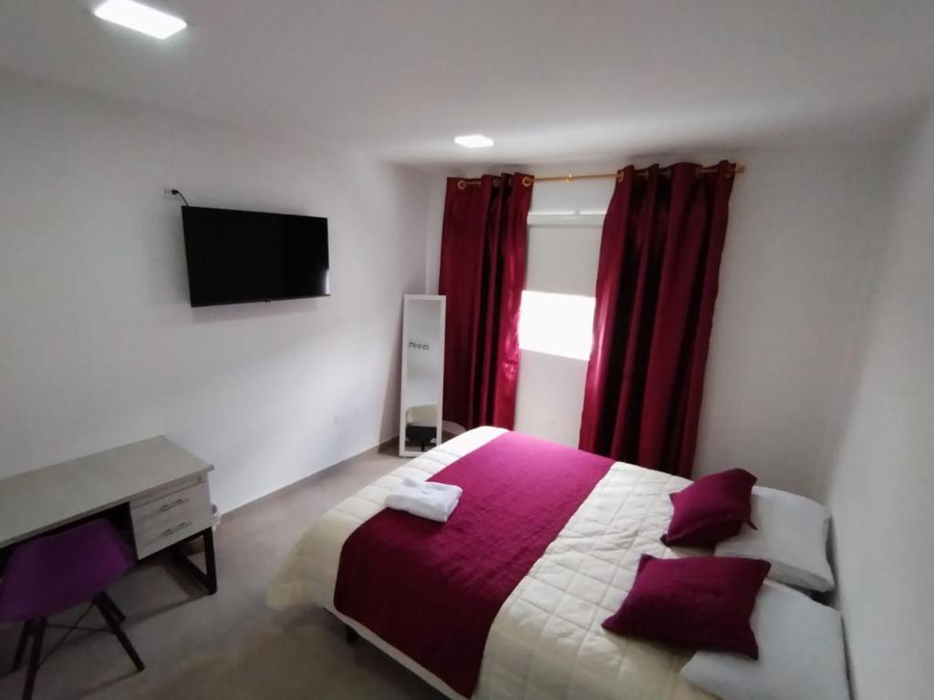 Postel nebo postele na pokoji v ubytování HOSTAL VERONA