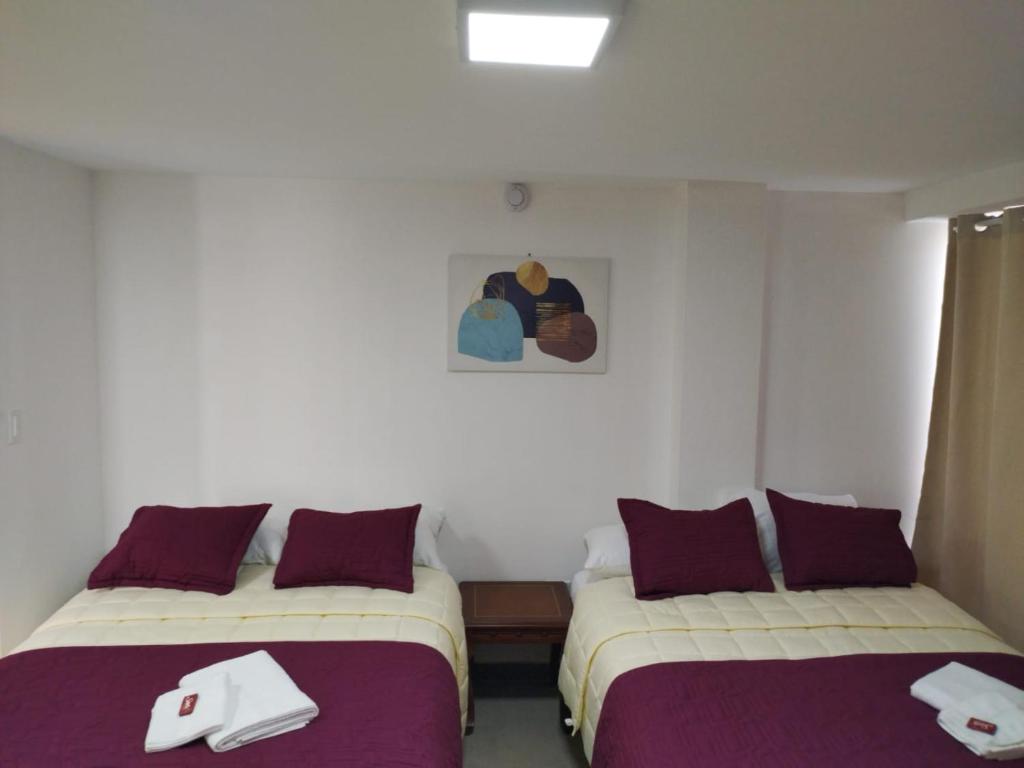 Postel nebo postele na pokoji v ubytování HOSTAL VERONA