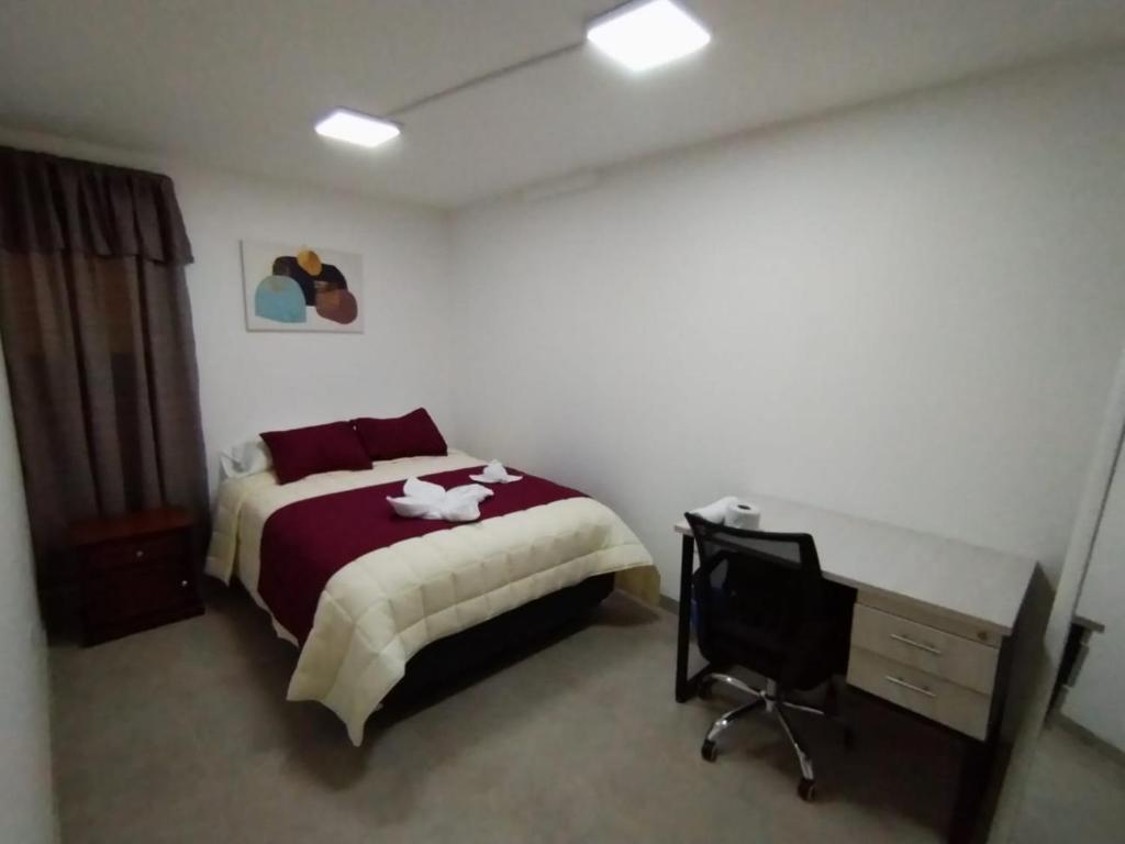 Postel nebo postele na pokoji v ubytování HOSTAL VERONA