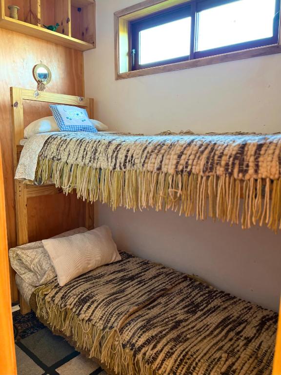 Postel nebo postele na pokoji v ubytování Ecos de Catrianca