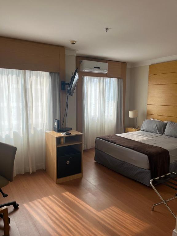 Ένα ή περισσότερα κρεβάτια σε δωμάτιο στο Hotel Aeroporto Congonhas com estacionamento grátis 1714