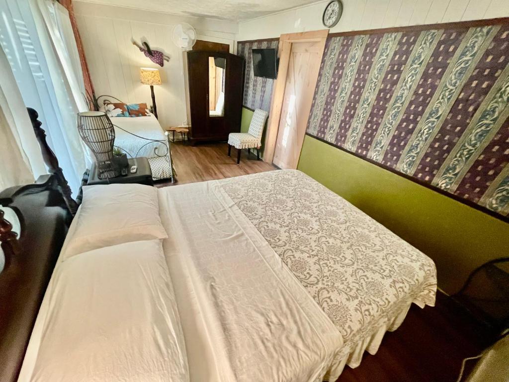 Postel nebo postele na pokoji v ubytování Shaka Shak Guest House
