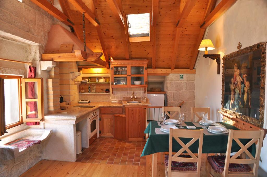 a kitchen with a table with a green table at Apartment Korcula Town in Korčula