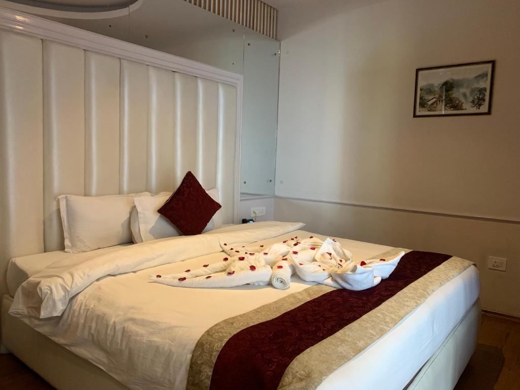 Voodi või voodid majutusasutuse Hotel Smarak toas