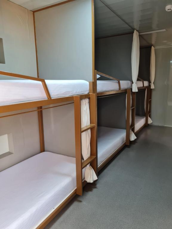 Postel nebo postele na pokoji v ubytování Ooni Hostel Moalboal