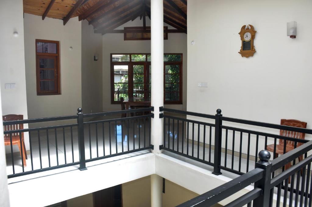 a staircase leading to the second floor of a house at MALWATHTHA MOUNT VILLA KANDY in Kandy