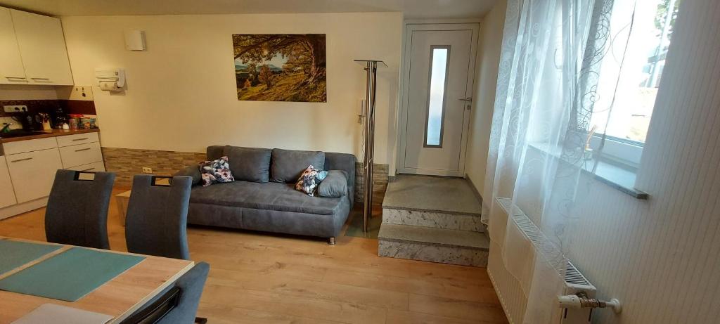 a living room with a couch and a table at Apartment Popp Heilbronn in Heilbronn