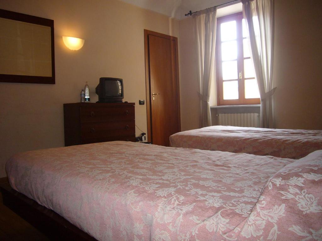 Postel nebo postele na pokoji v ubytování Albergo San Lorenzo