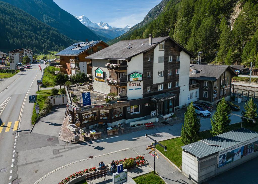 an aerial view of a hotel in a mountain town at Hotel Taescherhof in Täsch