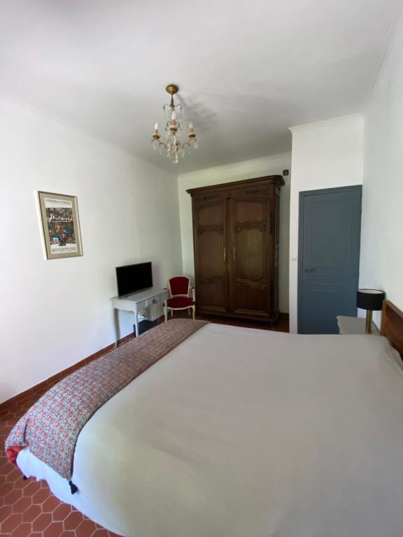 Postel nebo postele na pokoji v ubytování chambre privée chez l'habitant