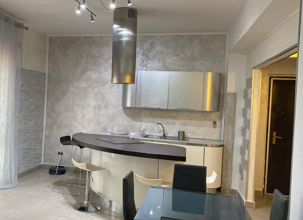 a kitchen with a sink and a counter top at Kennedy Apartment in Quattromiglia