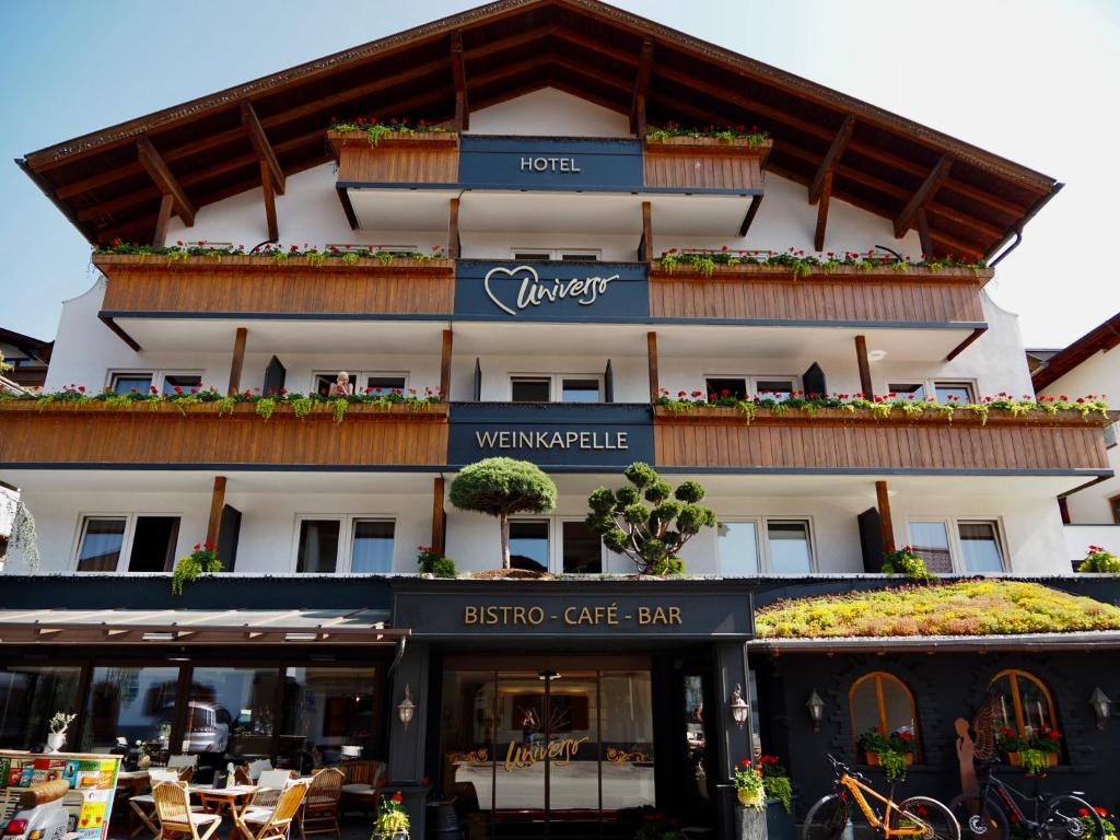 a building with a sign for a hotel at Hotel Universo in Serfaus