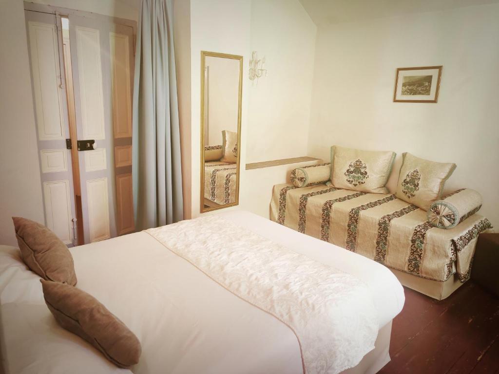 Postel nebo postele na pokoji v ubytování Hôtel Restaurant U Castellu Vizzavona
