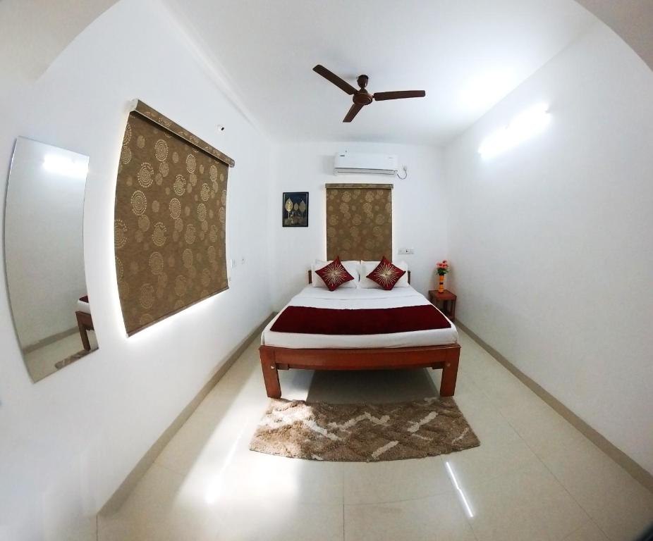 Postel nebo postele na pokoji v ubytování Royal Beach Service Apartment