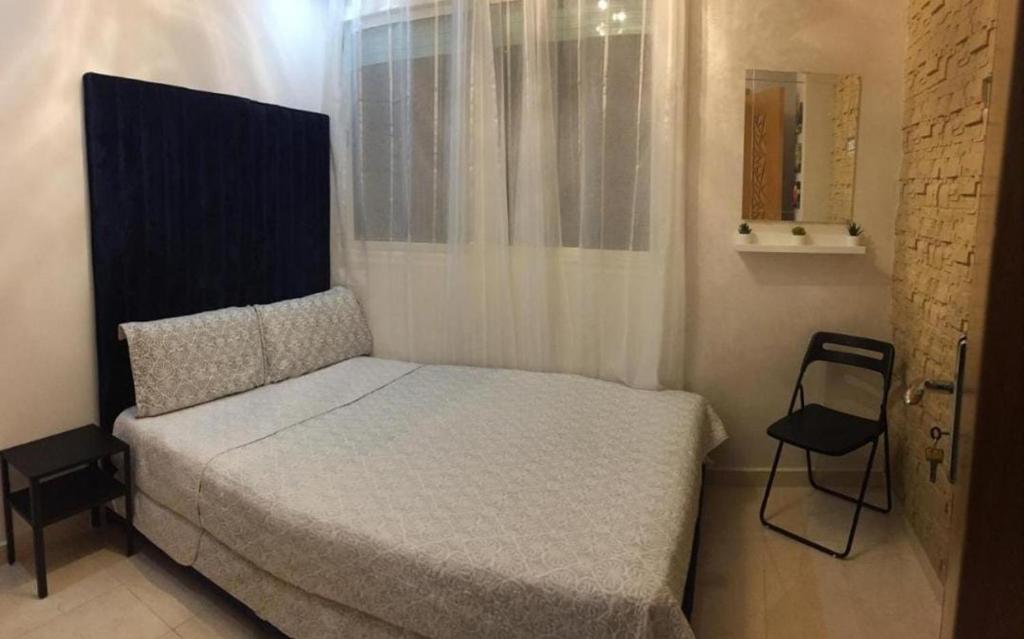 Postel nebo postele na pokoji v ubytování Chambre haut standing