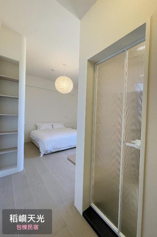 Letto o letti in una camera di 稻嶼天光包棟民宿