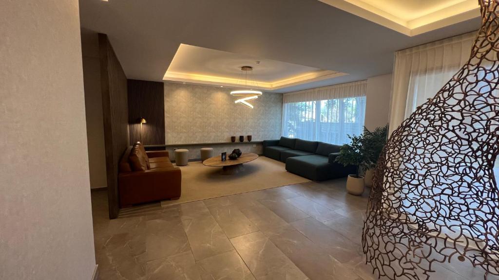 a large living room with a bed and a couch at Guesthouse Park in Cordoba