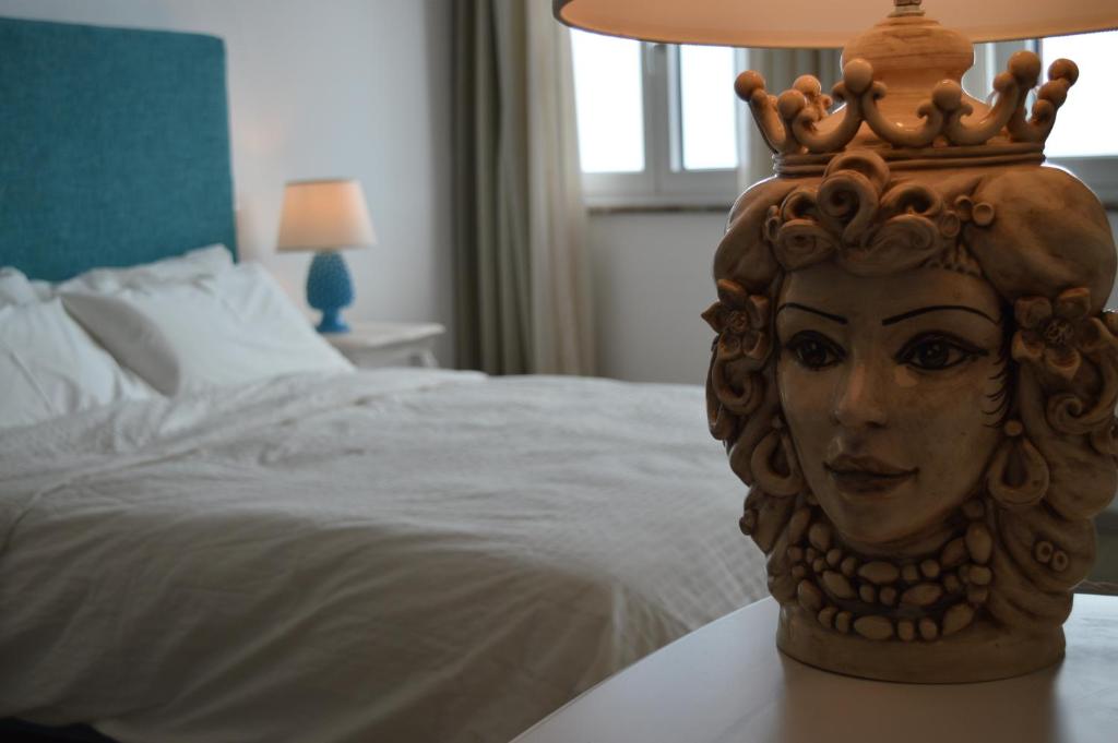 Postel nebo postele na pokoji v ubytování Villa Quisisana Taormina