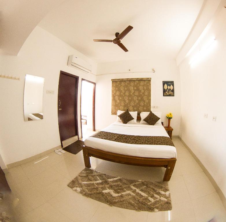 Postel nebo postele na pokoji v ubytování Royal Beach Service Apartment