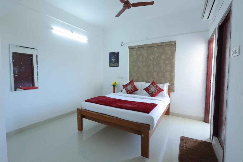 Postel nebo postele na pokoji v ubytování Royal Beach Service Apartment