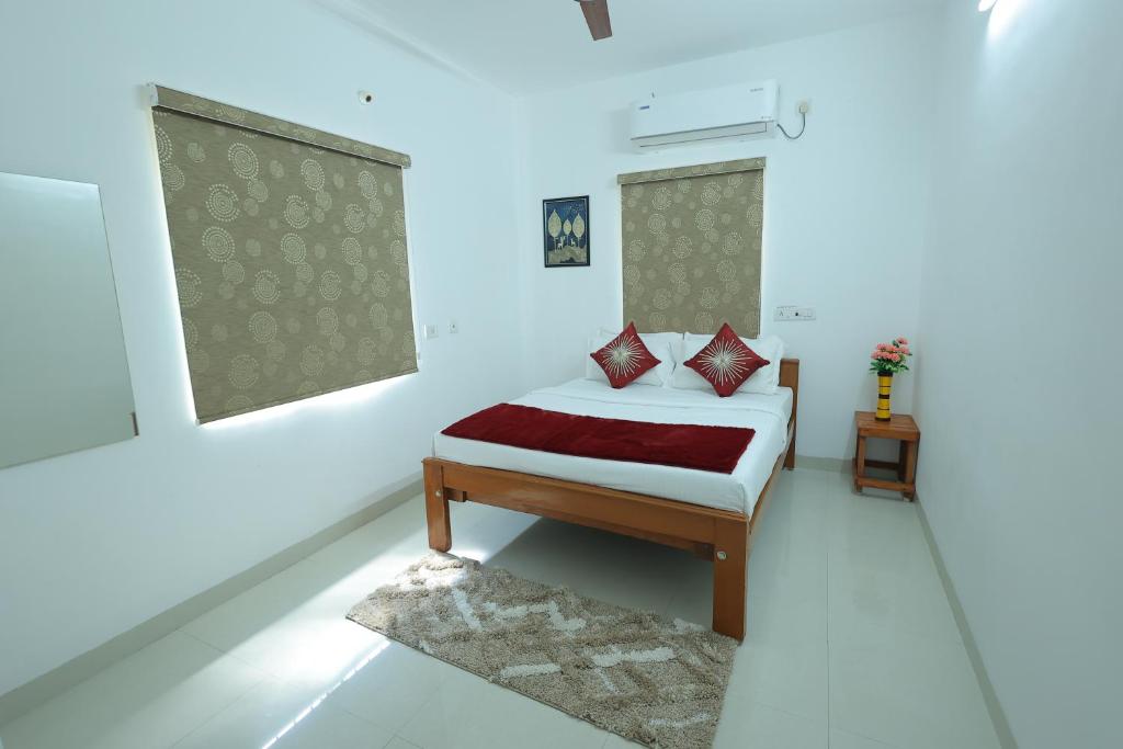 Postel nebo postele na pokoji v ubytování Royal Beach Service Apartment