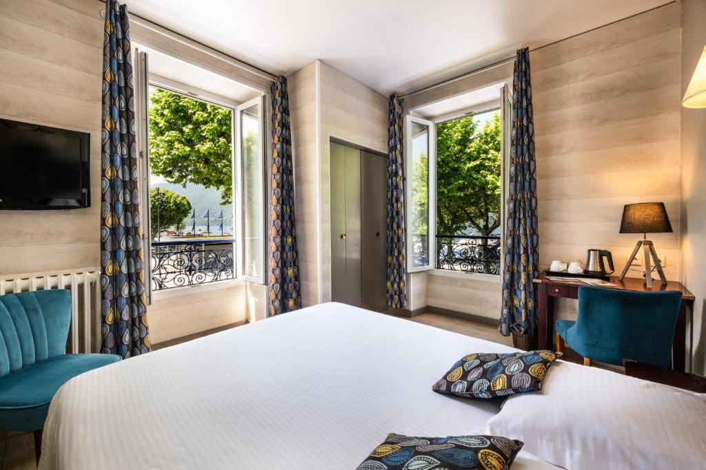 Postel nebo postele na pokoji v ubytování Hotel Beau Rivage