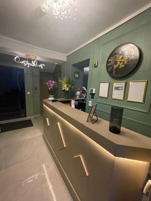 a dressing room with a counter and a mirror at HOTEL LOUVAIN in Paris